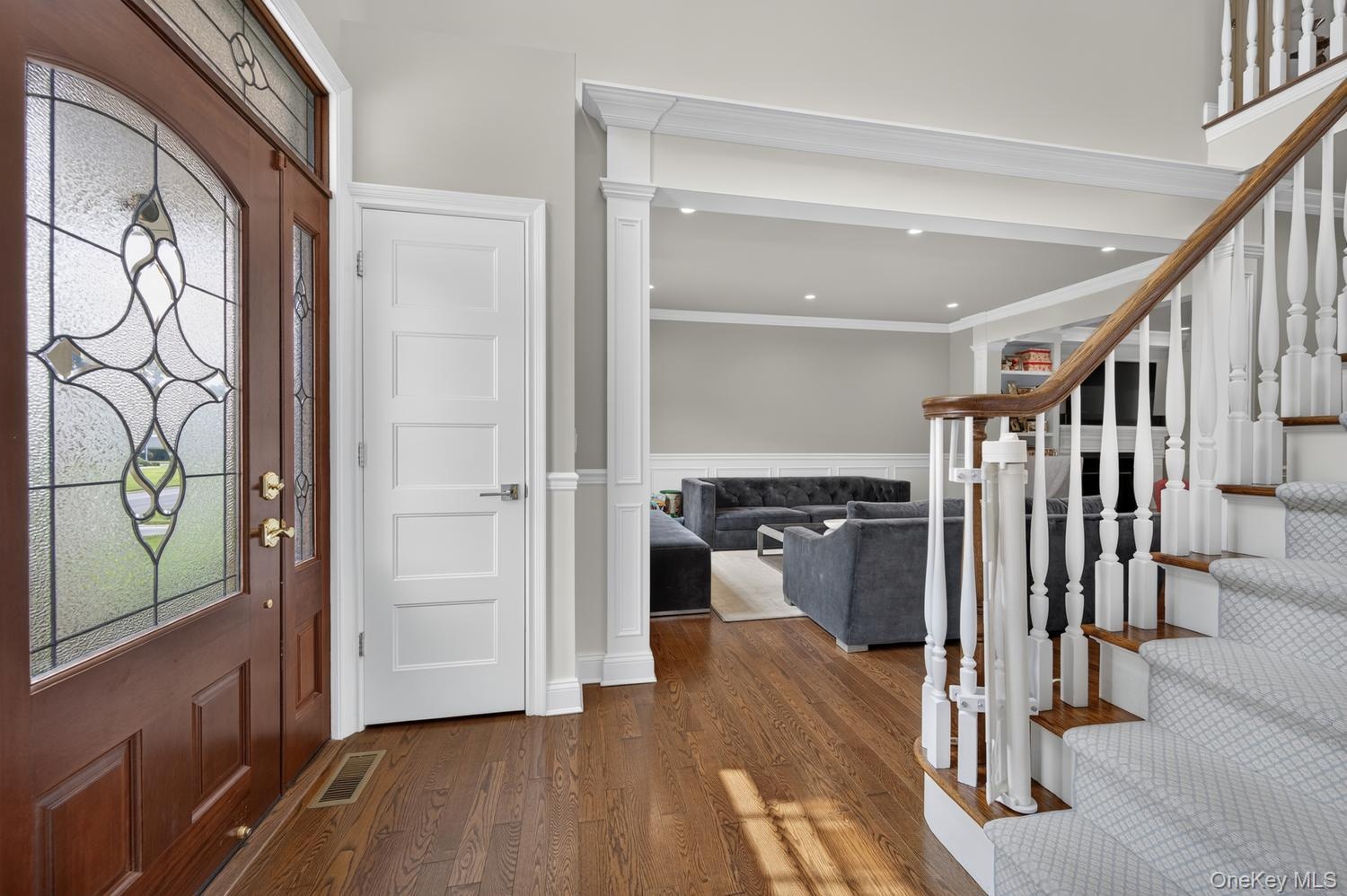 Gracious Entrance Foyer with hard wood floor.