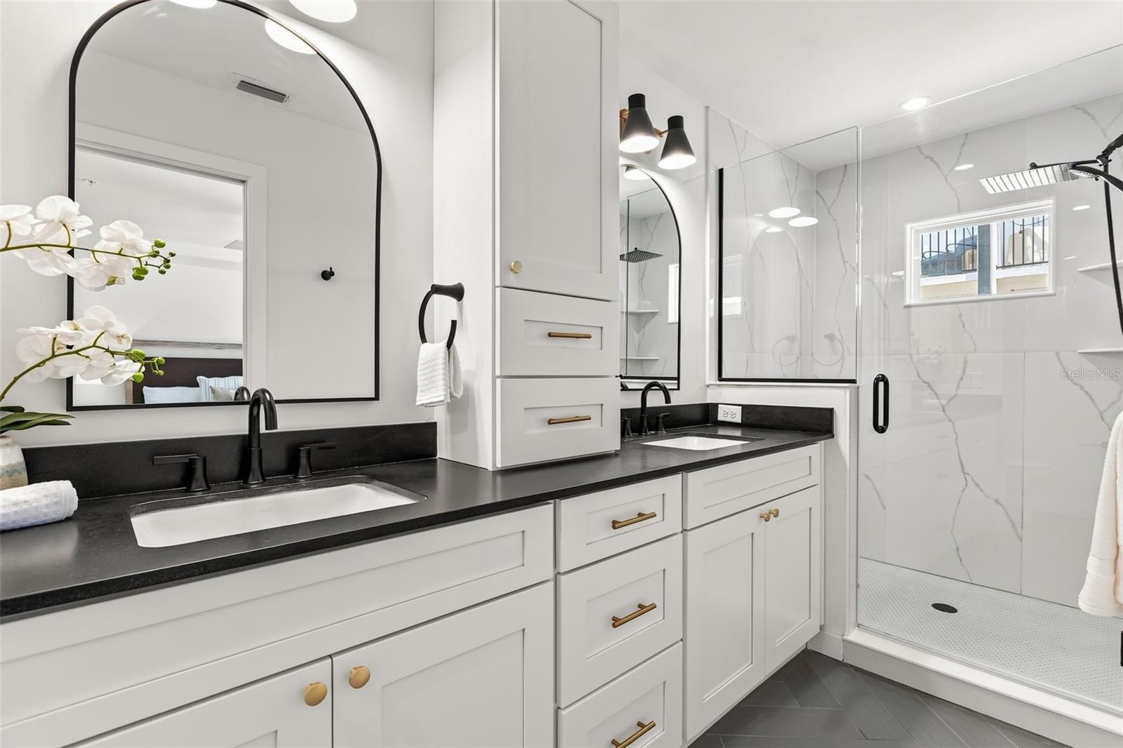 Level Two: Ultra Luxurious Primary en suite bathroom with double vanity sinks.