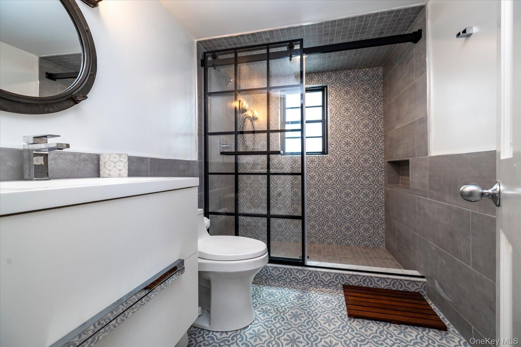 Brand new bathroom wtih walk in shower and glass door