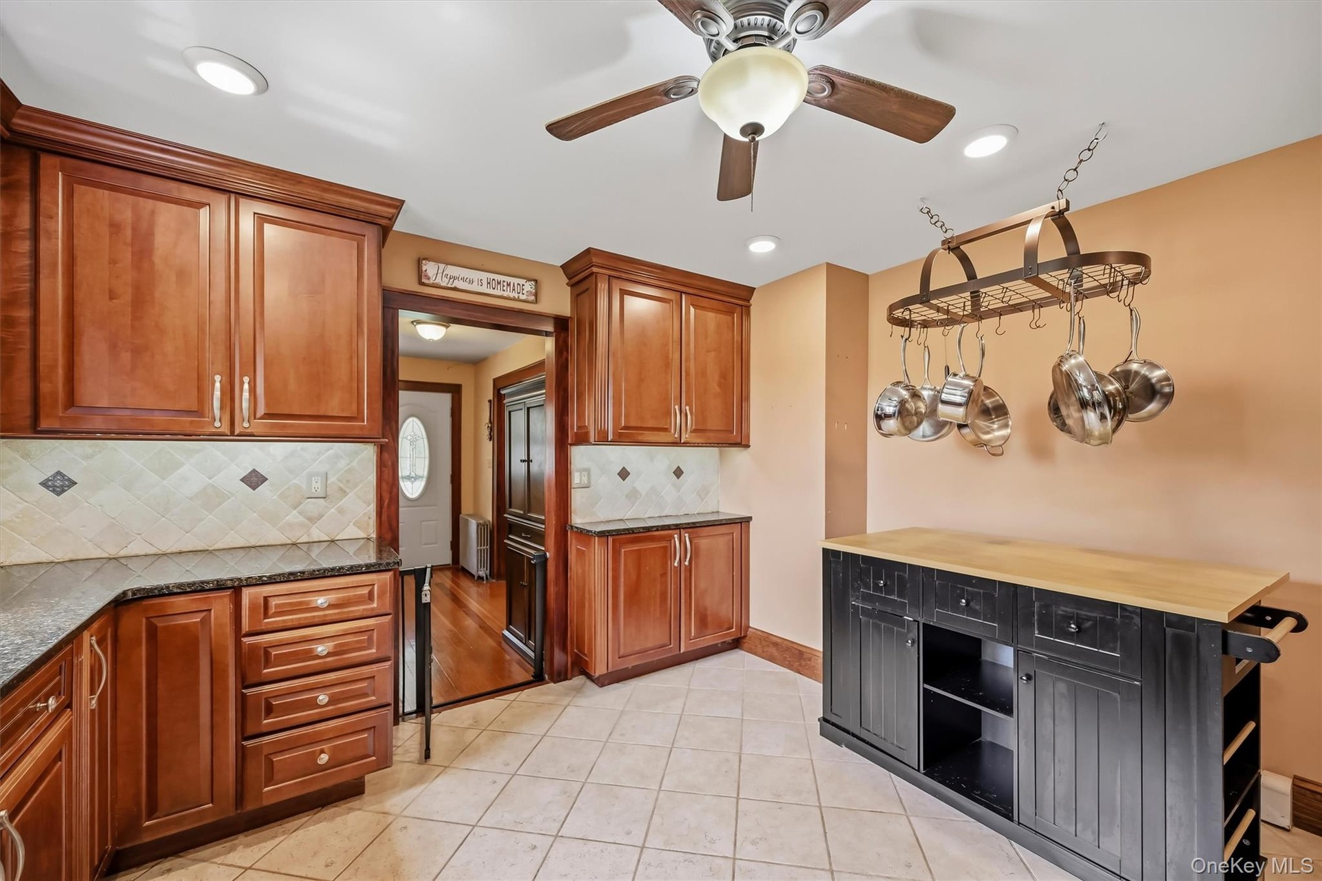 Spacious kitchen offering ample cabinet storage and generous counter space.