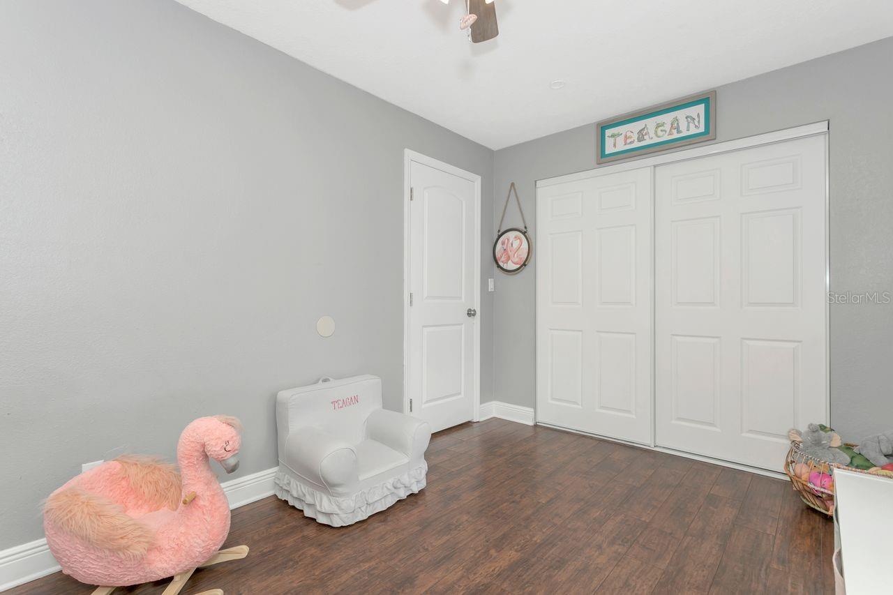 Bedroom #2 with LVP Flooring; Ceiling Fan; Extended Built-In Closet