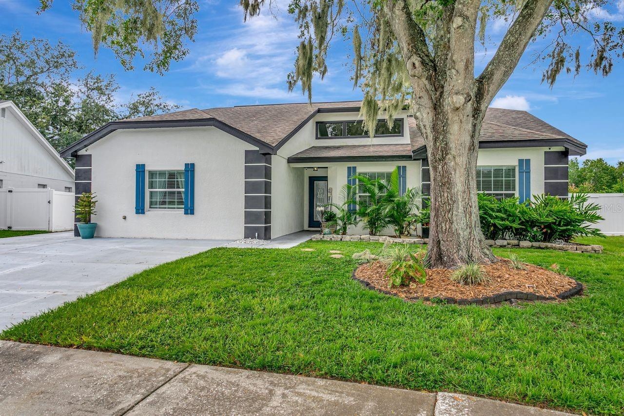 Front of 4 Bedroom Pool Home with 3 Bathrooms, Remodeled Kitchen and Tons of Living Space!