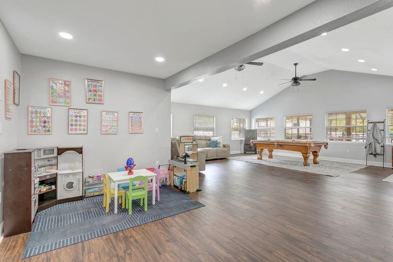 View of Great Room with Vaulted Ceilings and Flex Space adjacent to the Kitchen - May serve as Formal Dining, Play Room, Office Space, etc.