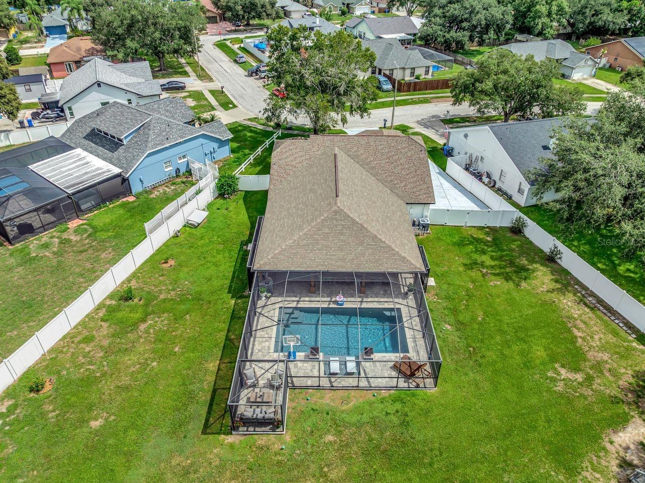 View of Backyard, Playground, Two Covered Open-Air Structured Storage areas with Concrete Pads, Firepit, and Shed. Bring the Boat- Bring the Toys - Th