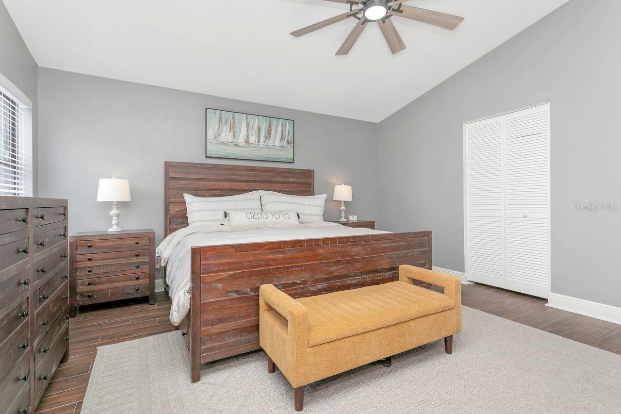 Primary Bedroom with LVP Flooring; Upgraded Ceiling Fan; En-Suite Bathroom; Dual Closets