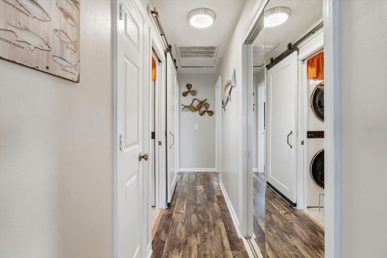 Interior hallway with convenient access to the laundry area.