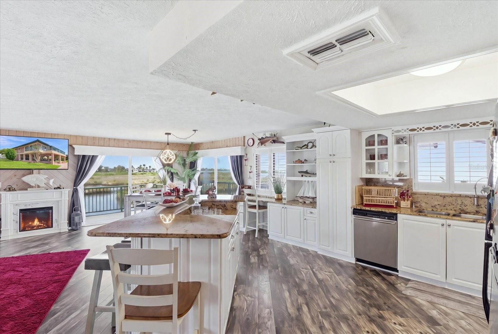 Kitchen and dining area positioned to take advantage of waterfront views.