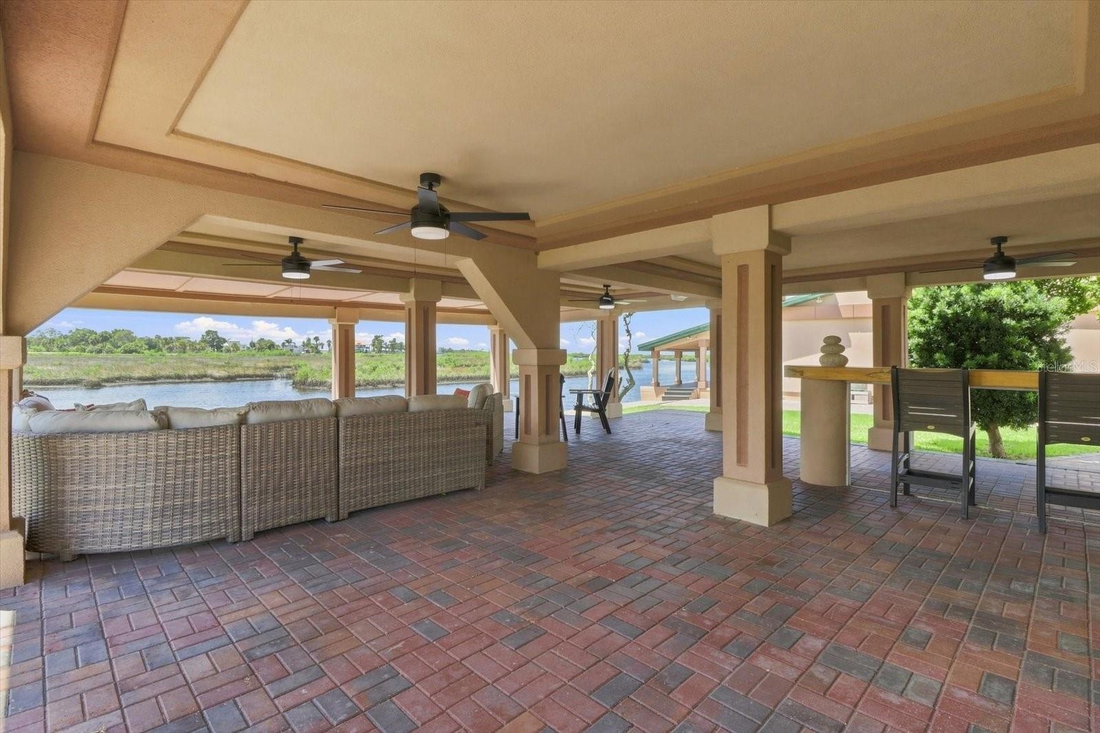 Expansive covered outdoor living and entertaining area beneath the residence.
