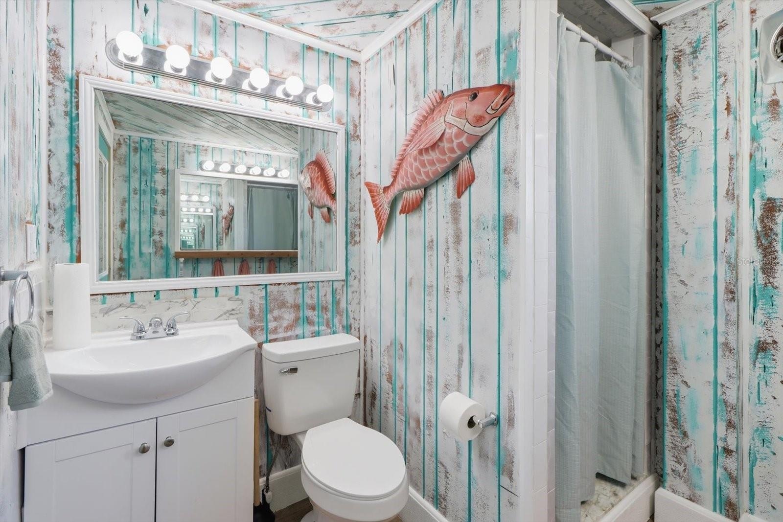 Additional bathroom with coastal-inspired finishes.