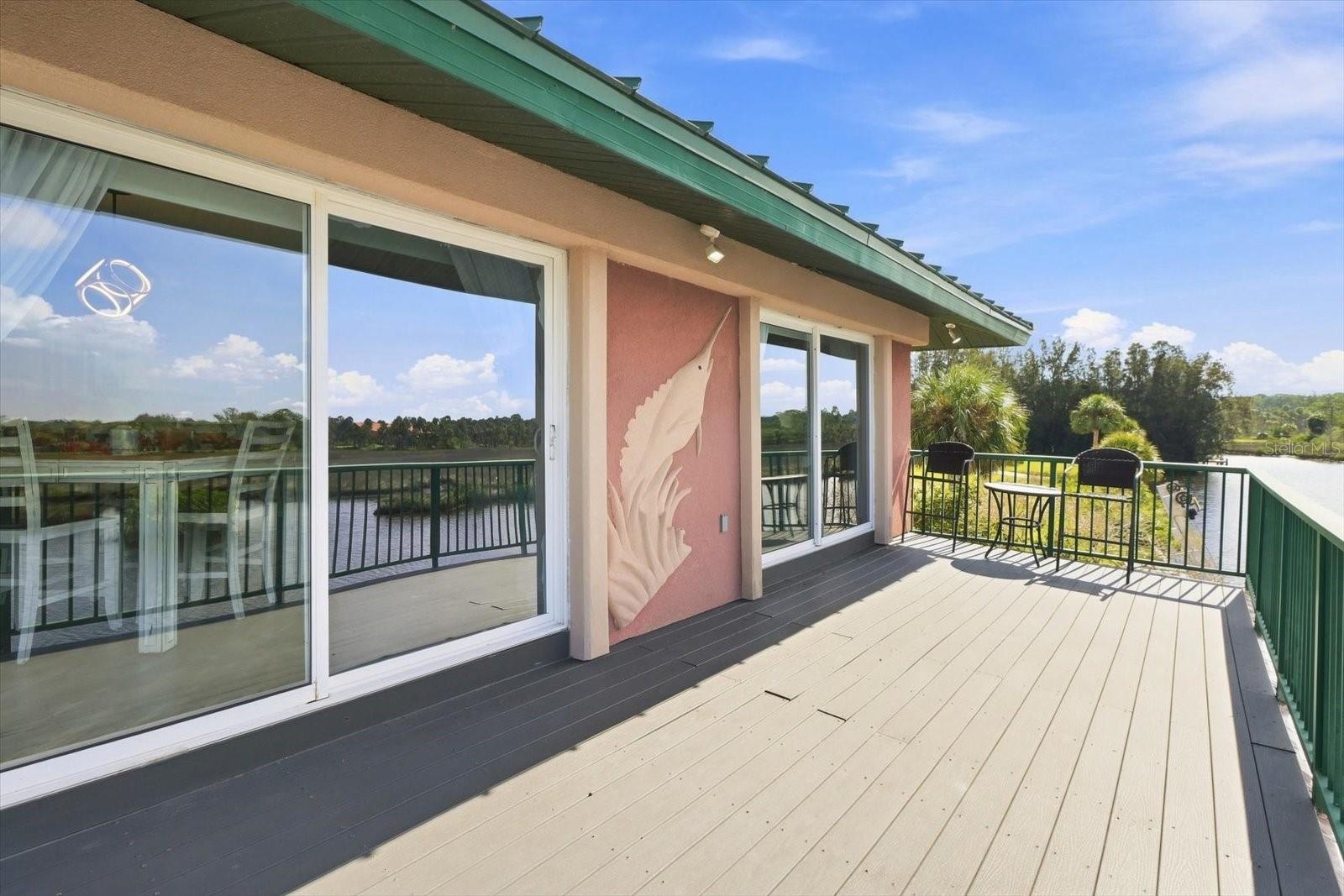 Spacious upper-level waterfront balcony.
