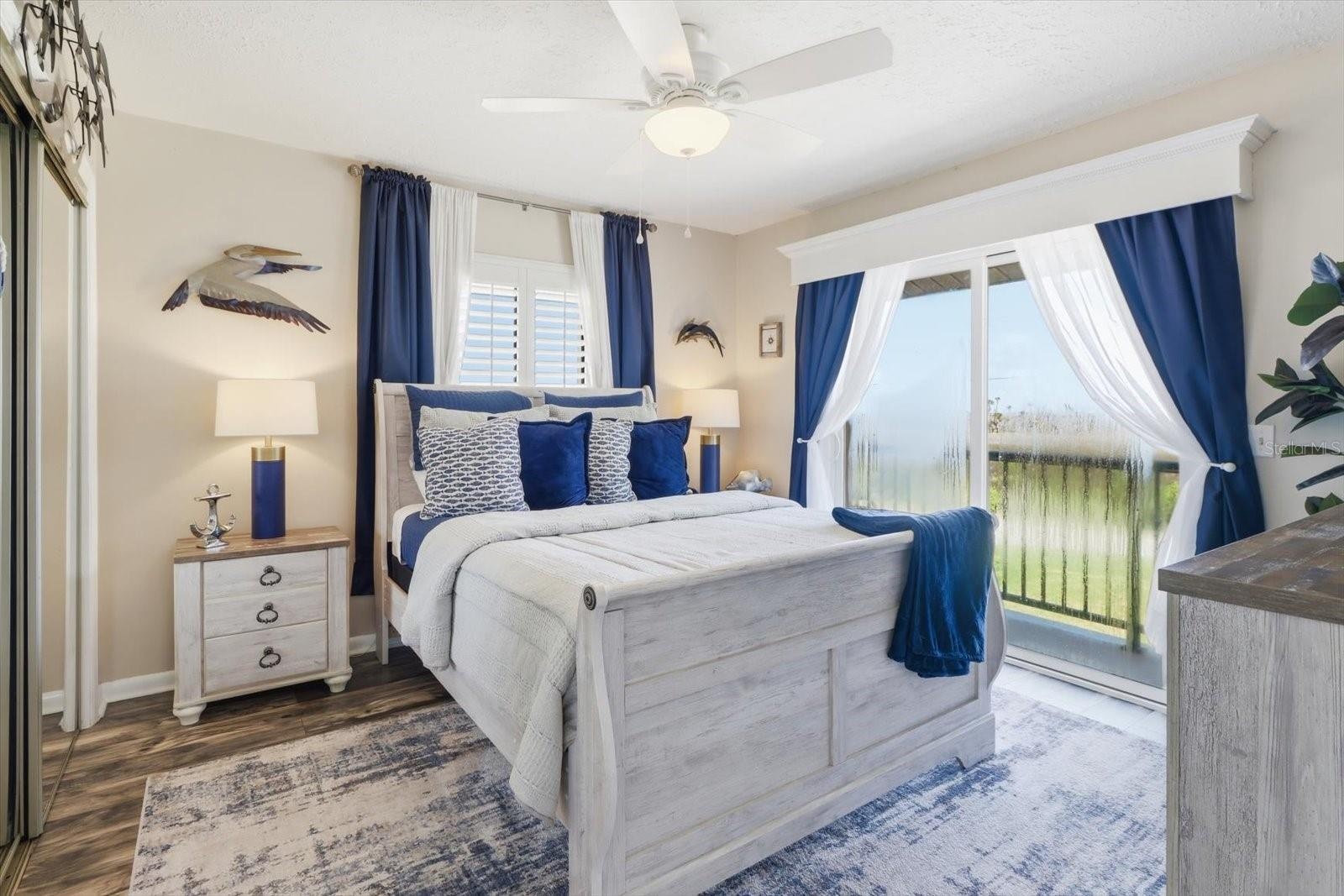 Guest bedroom with direct access to the waterfront balcony.