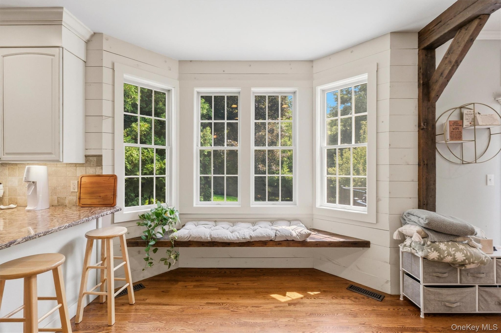 A charming window seat completes the eat-in kitchen.