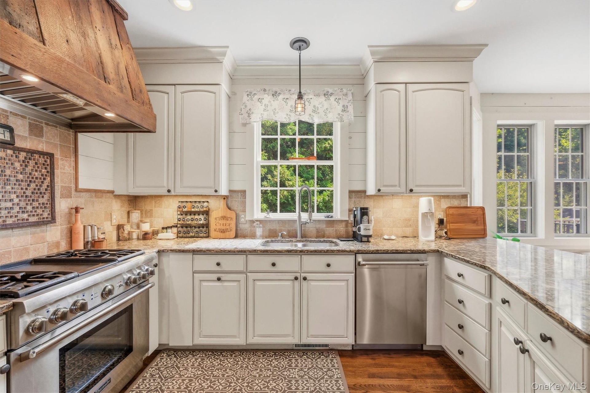 The kitchen boasts of high-end, stainless steel Thermador appliances.