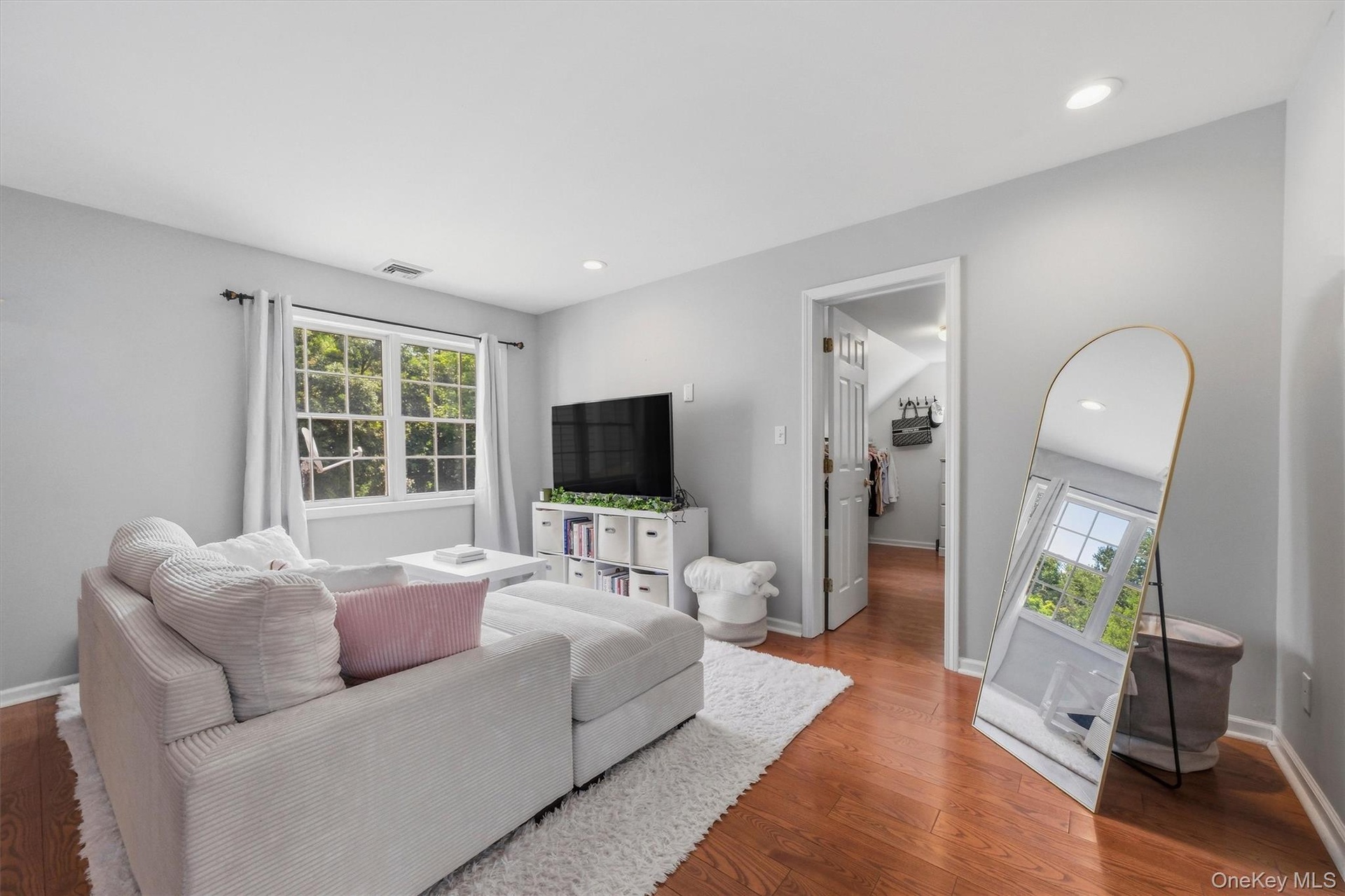 The primary bedroom is large enough for a separate lounging area.