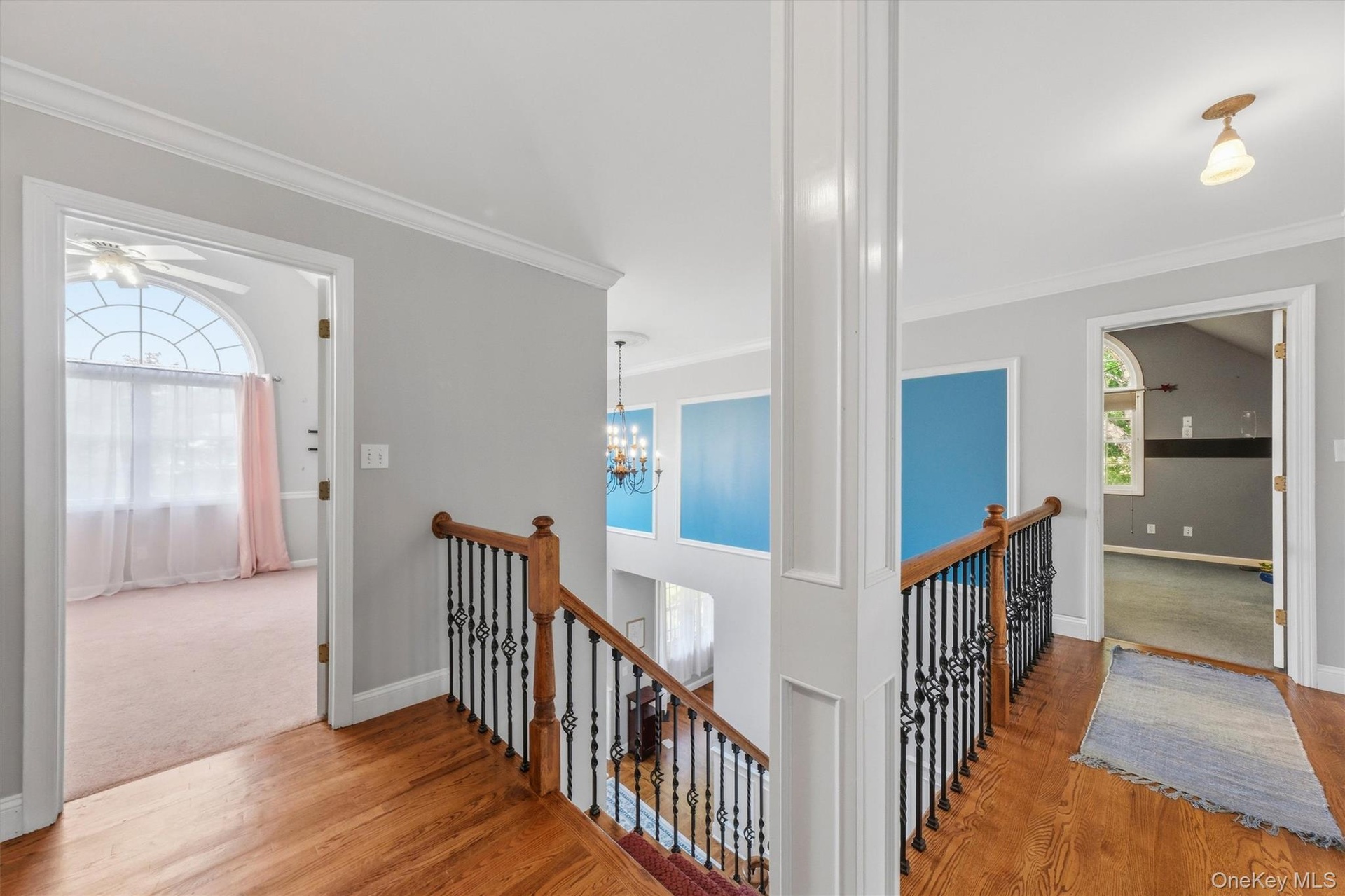 The second floor of the home features four generously sized bedrooms, two full baths, and a dedicated laundry room.