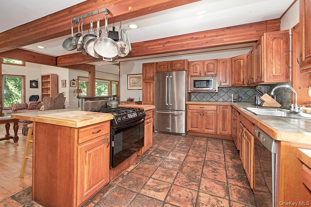 Another view of the kitchen, note the beautiful beams.