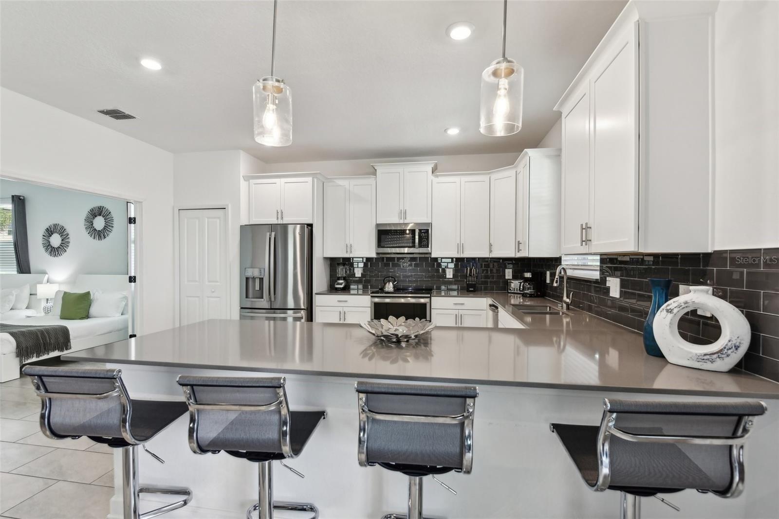 Open kitchen with bar seating