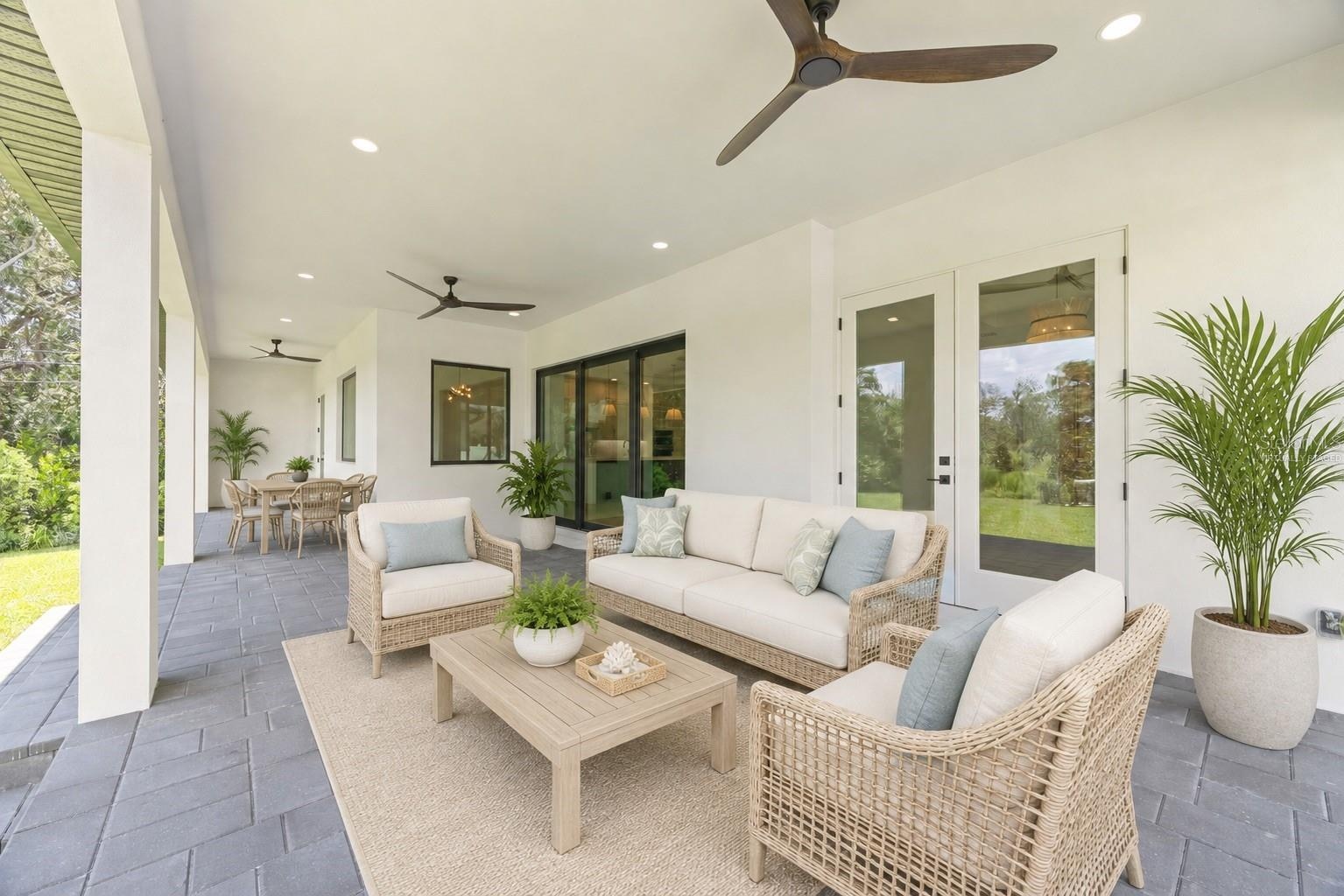 Virtually staged covered paver lanai.