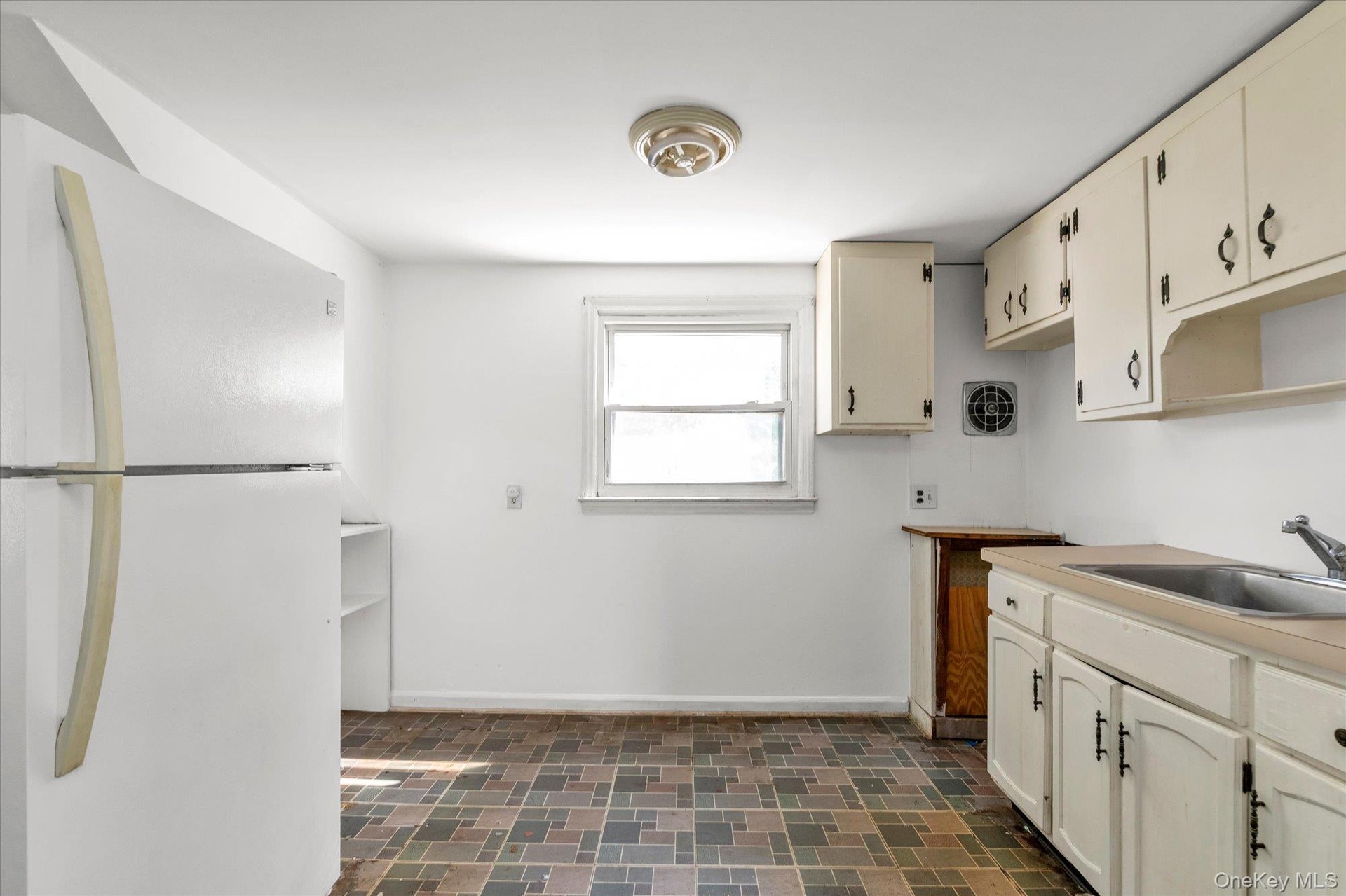 Cabinets for storage and fridge-No stove