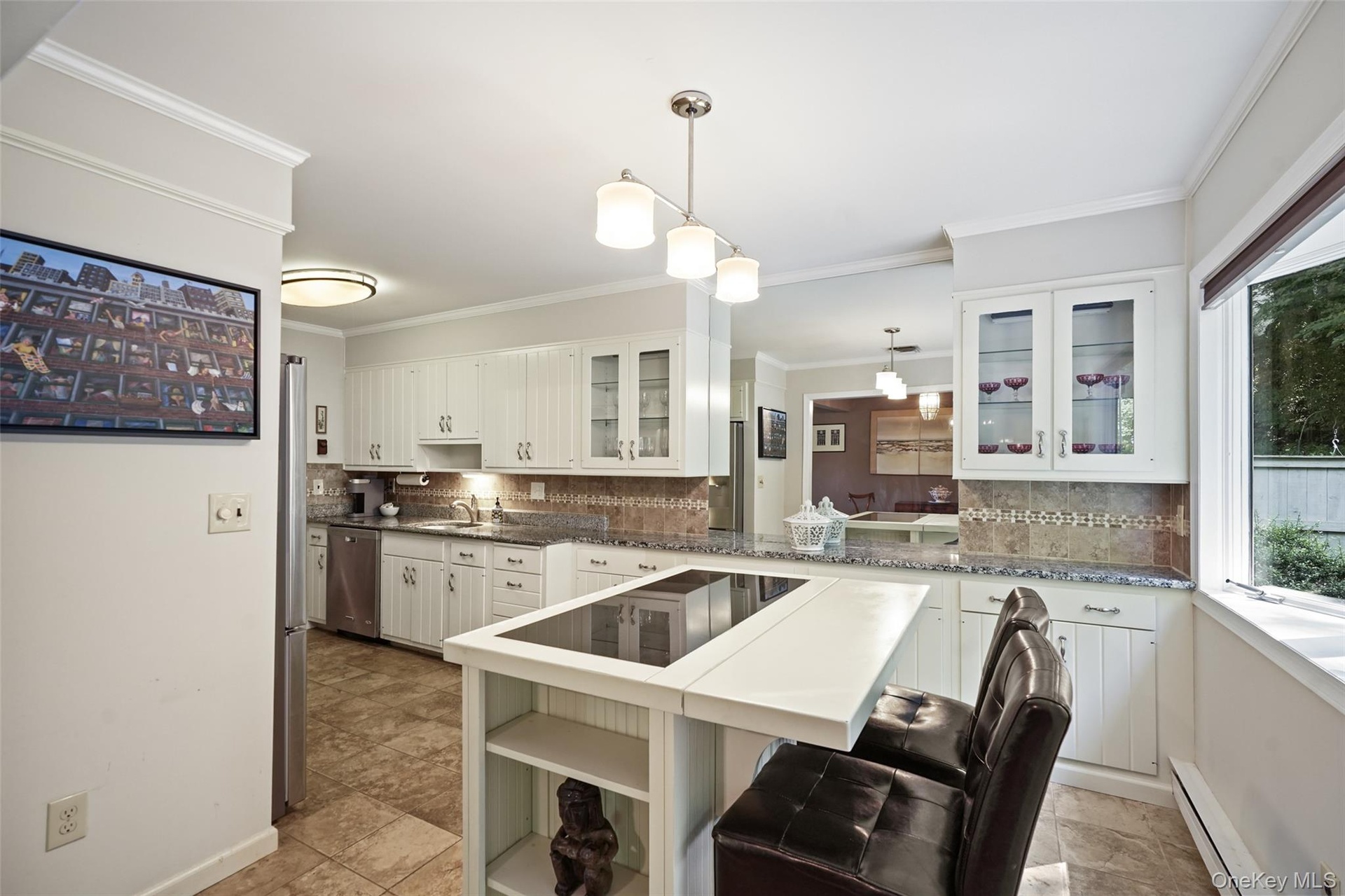 Island with seating and large bay window to enjoy Nature's beauty