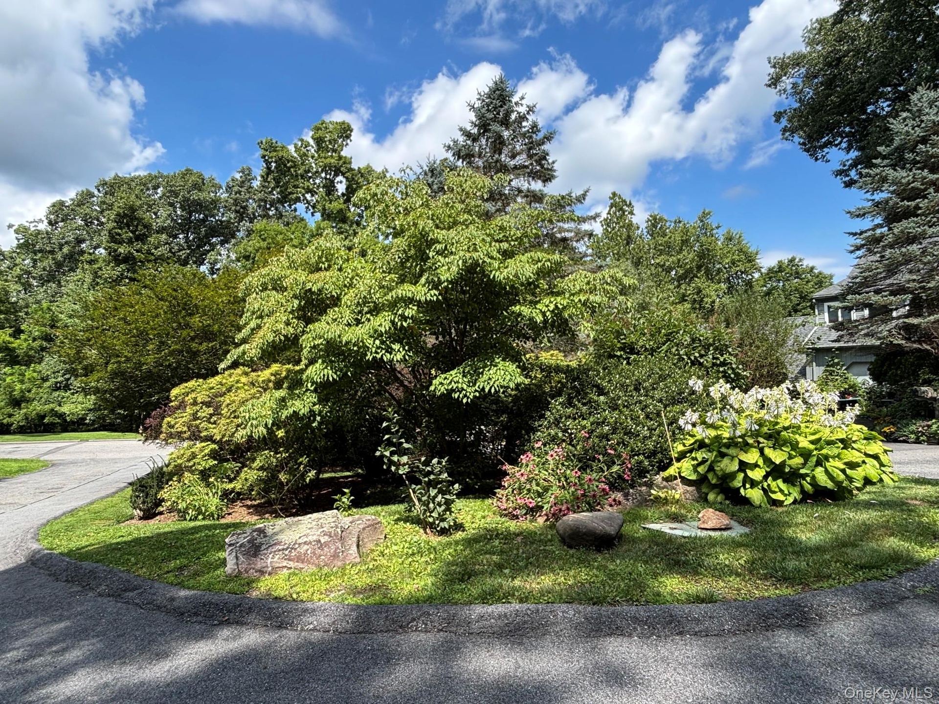 Welcome to Peach Court.  Center island with mature plantings offers privacy.