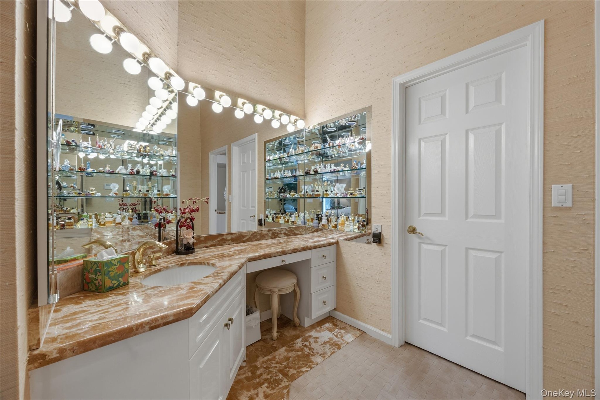 Primary Bedroom Dressing & Vanity Area with custom walk-in closet