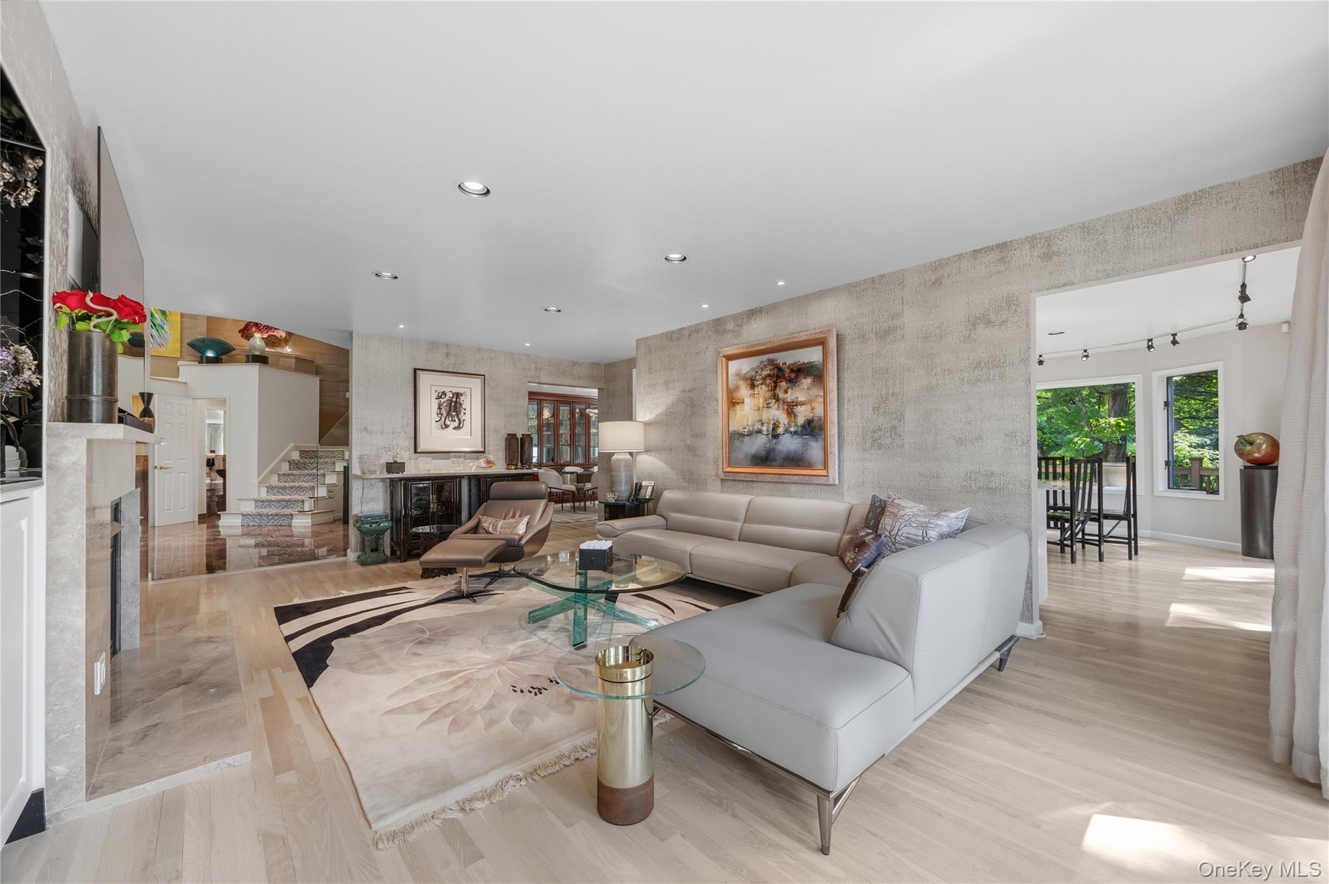 Alternate view of Family Room from the Living Room with a view of the beautiful Kitchen