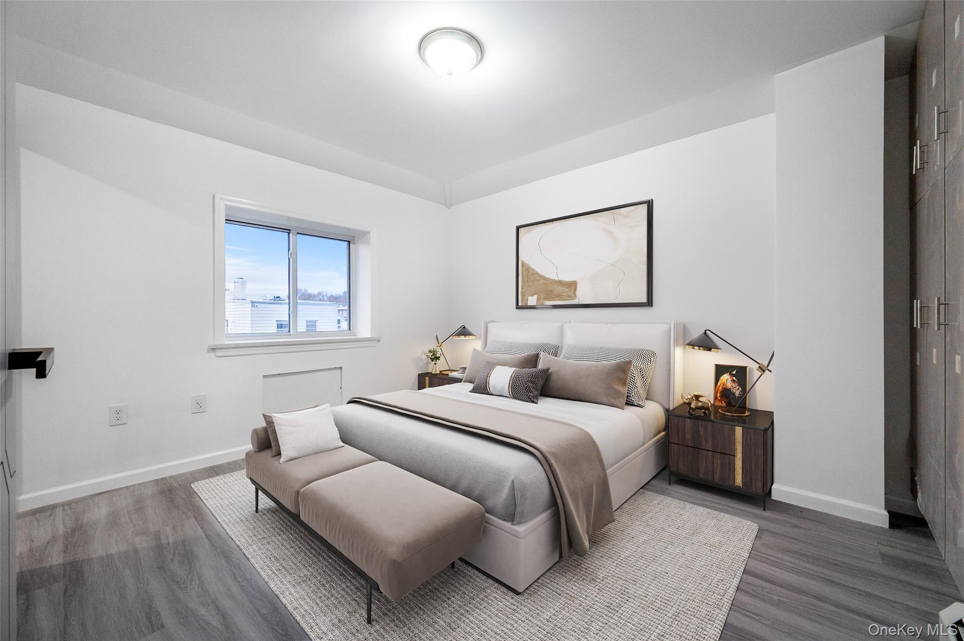 Bedroom with baseboards and wood finished floors