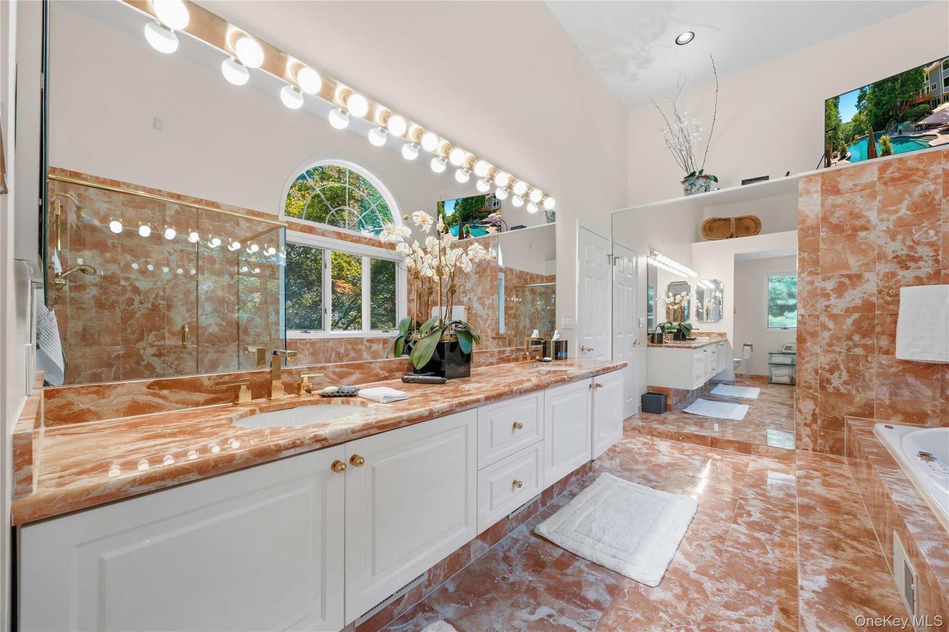 Huge Primary Bathroom  with marble double sink vanity