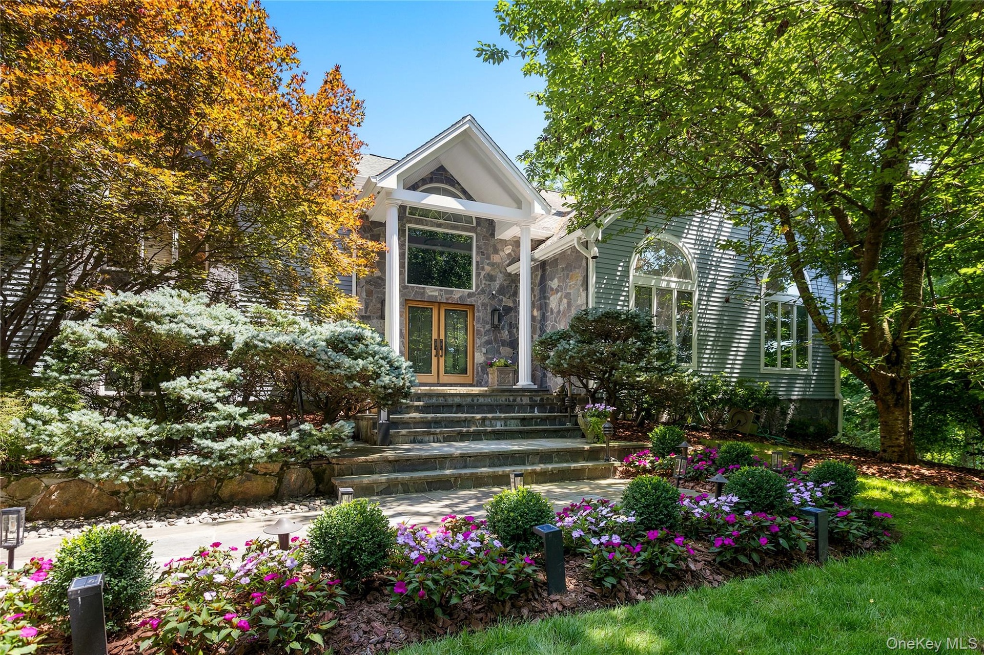 Custom designed and built contemporary colonial with professional landscaping and privacy.