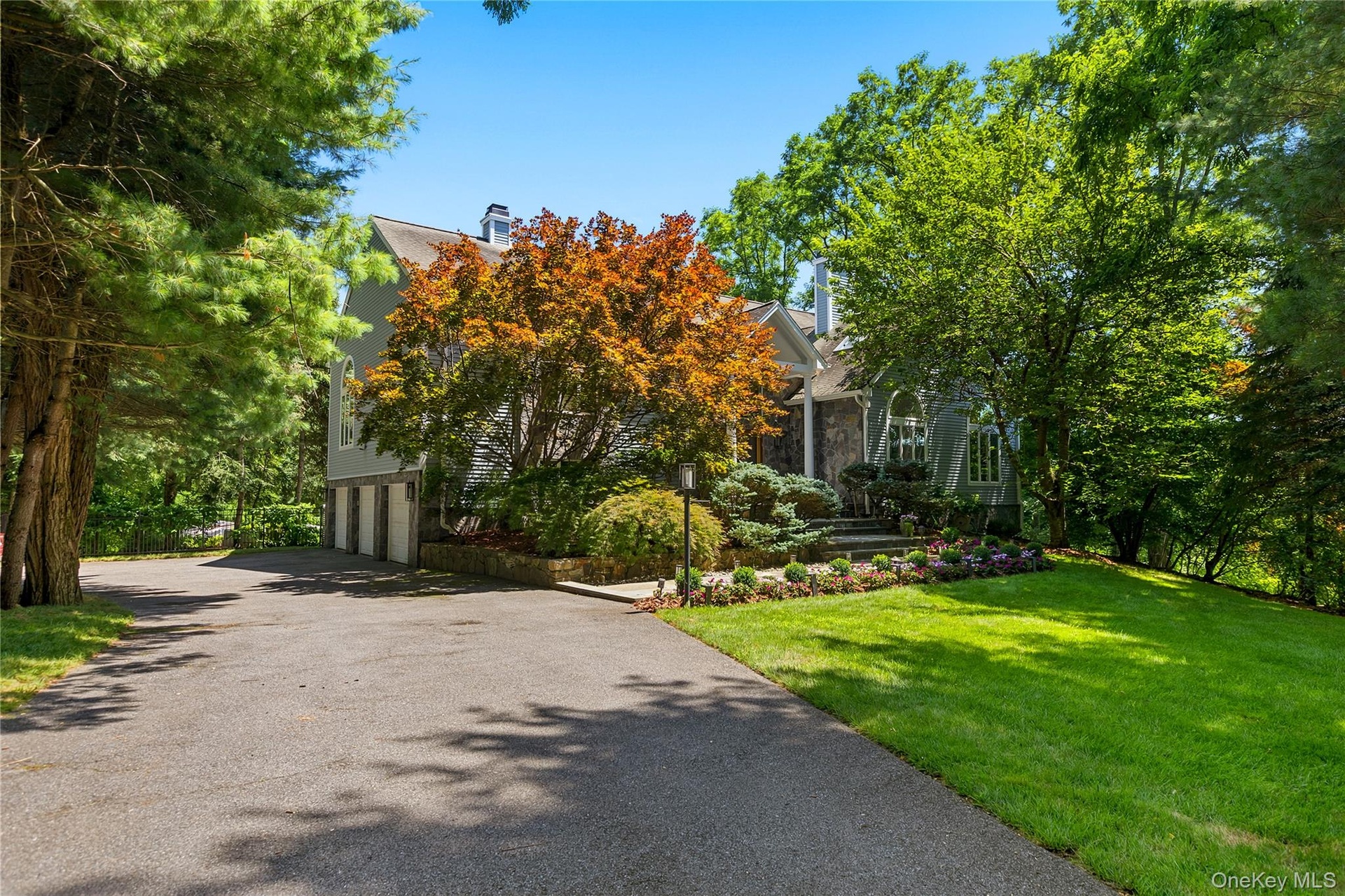 Set far back after the gated drive the approaching view of 6 Canterbury Court with 3 car garage