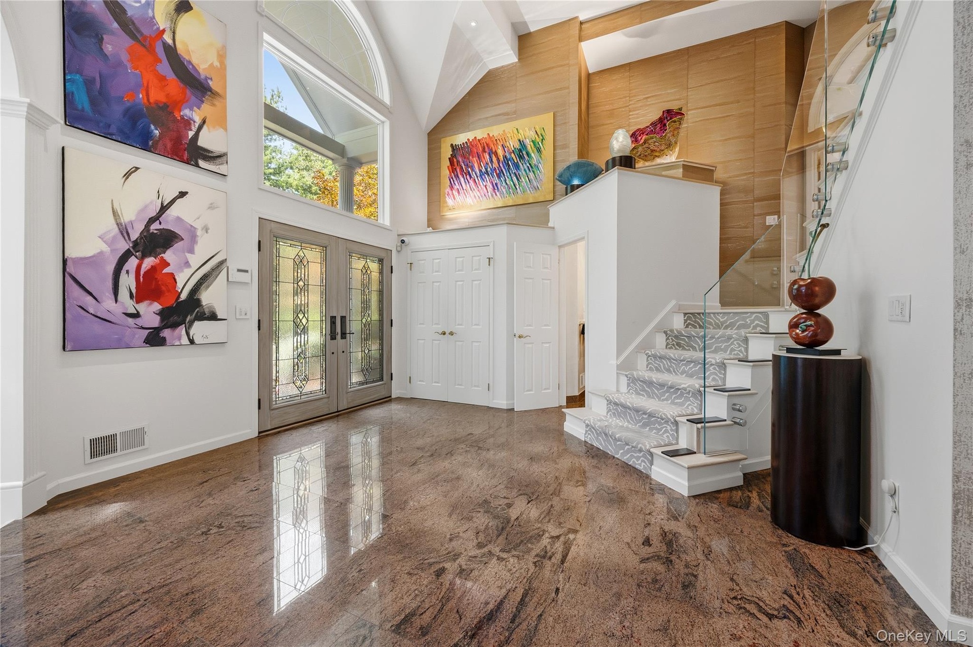 Granite floor, recessed lights, double high ceiling, coat closet