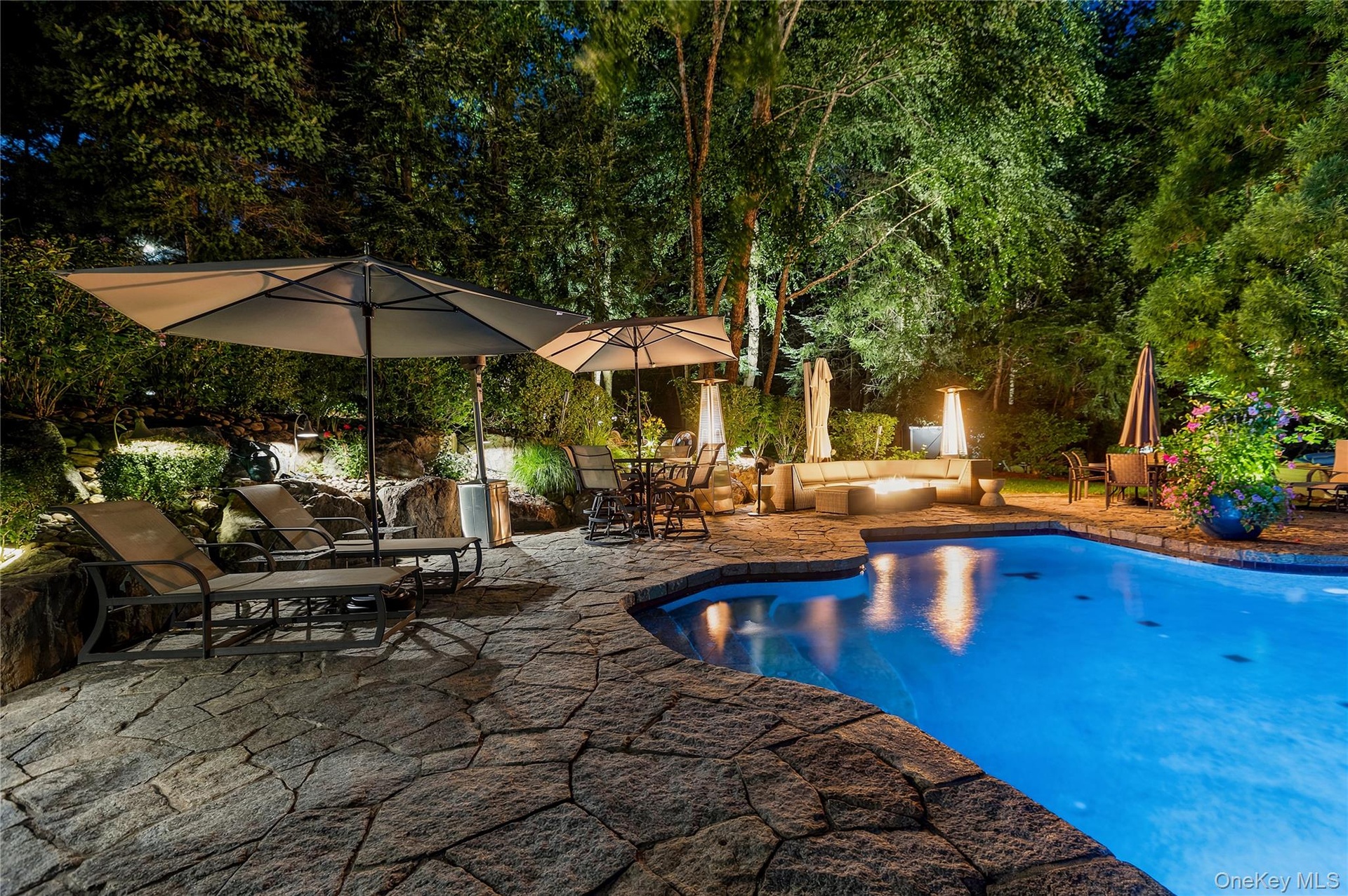 Enjoy relaxing by the pool in the evenings right into the fall with a firepit for warmth