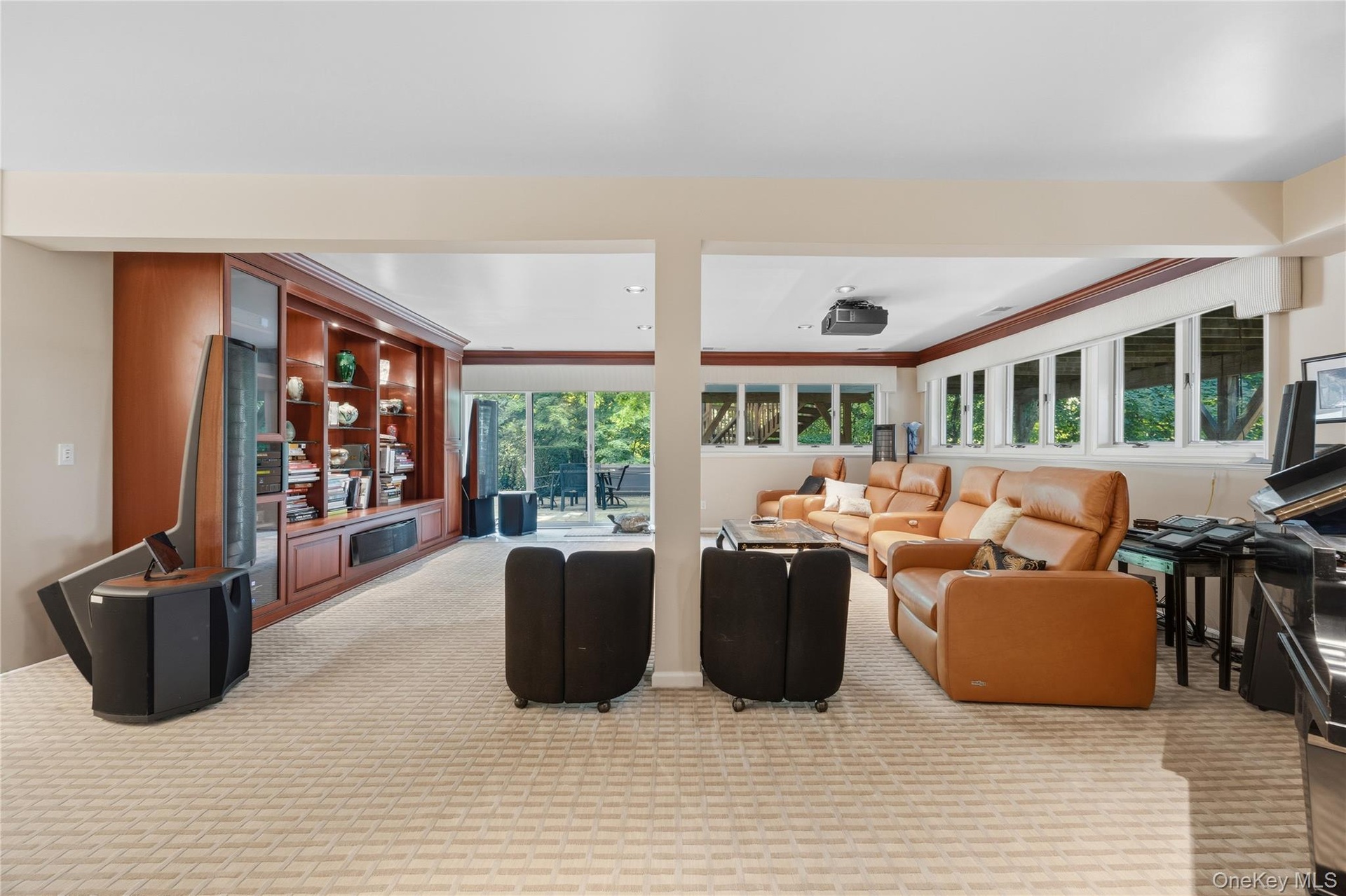 Track/recessed lighting, two double wide closets, sliding glass door to backyard patio