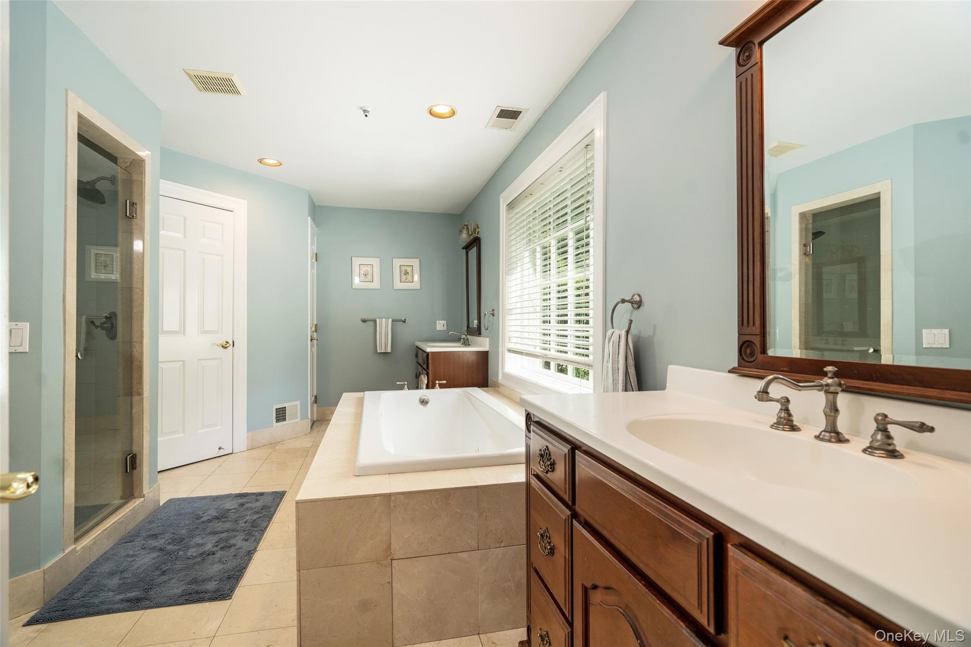 Your morning prep just got a lot easier. With a private water closet, thoughtful storage throughout, and a spacious walk-in closet, this primary bathr