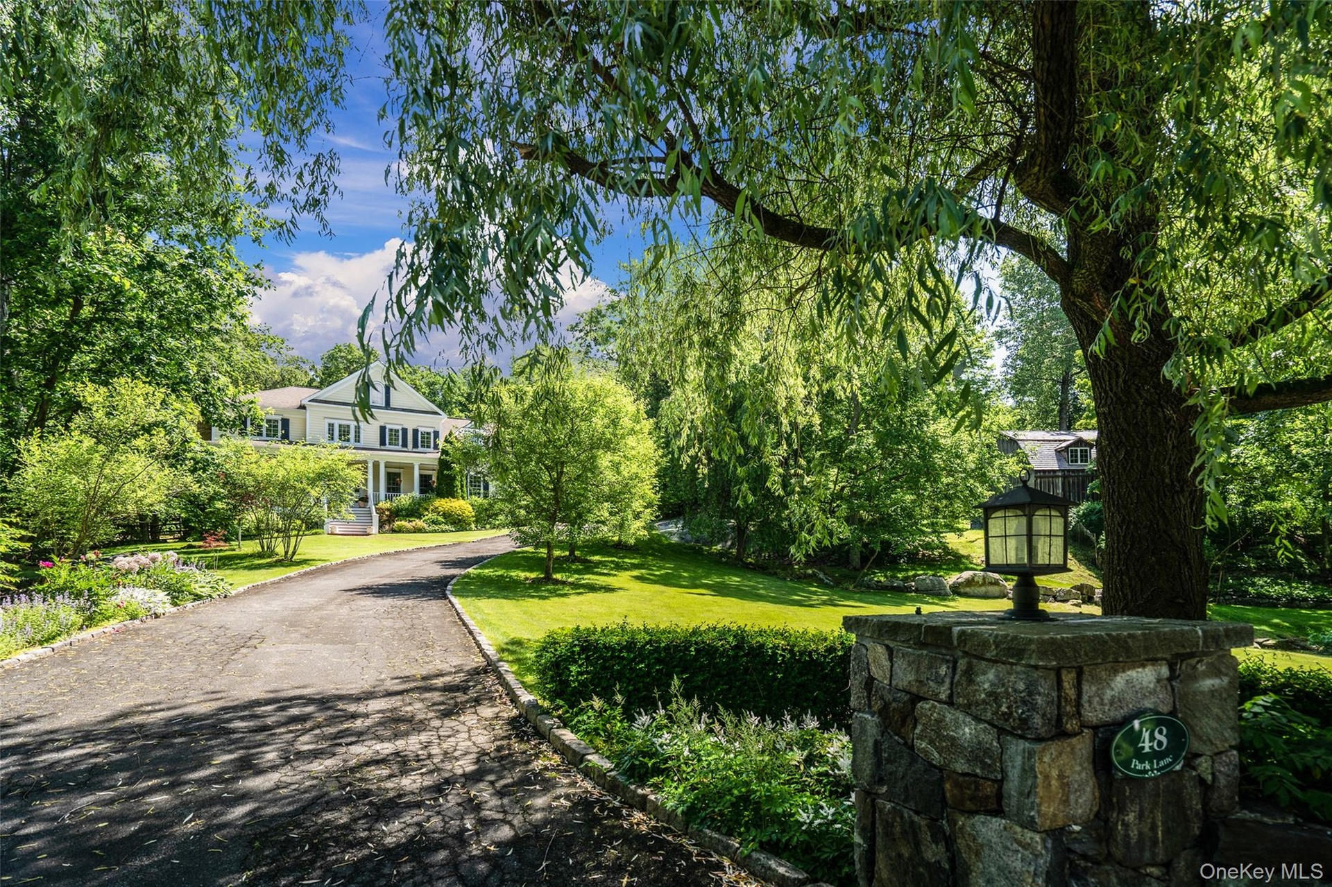 Tucked away off the street and enveloped by lush, beautiful gardens, this property offers an exceptional level of privacy.  Make it yours today!