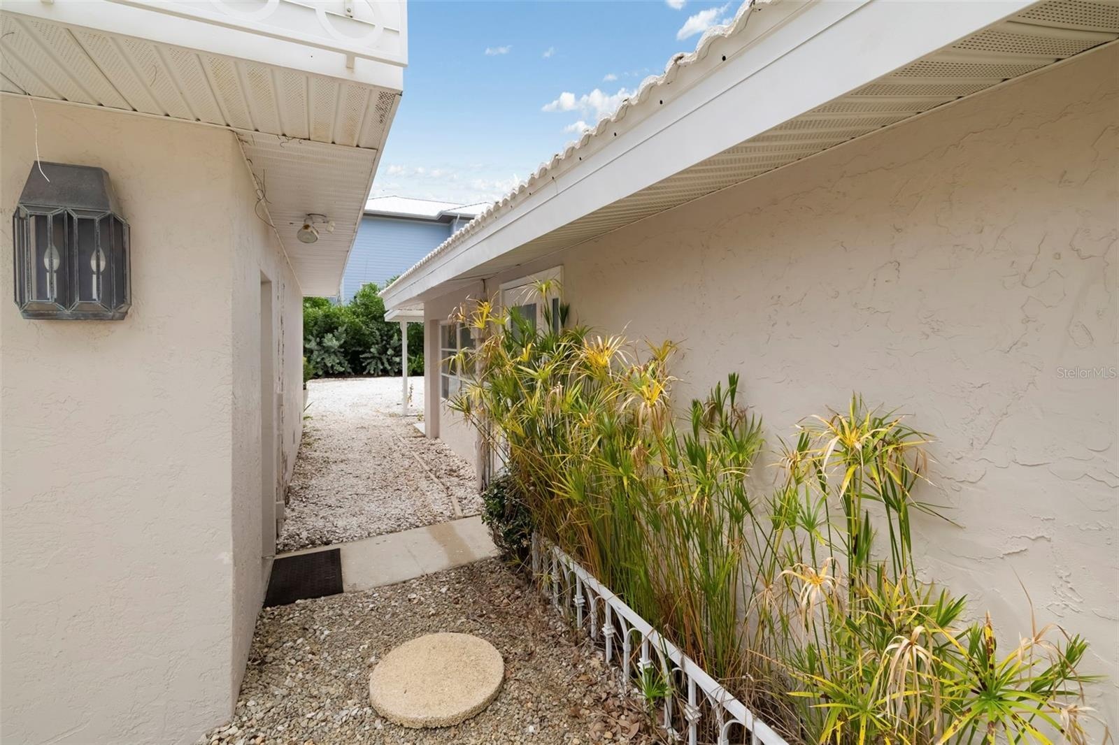 Walk through between the house and the oversized detached 2-car garage