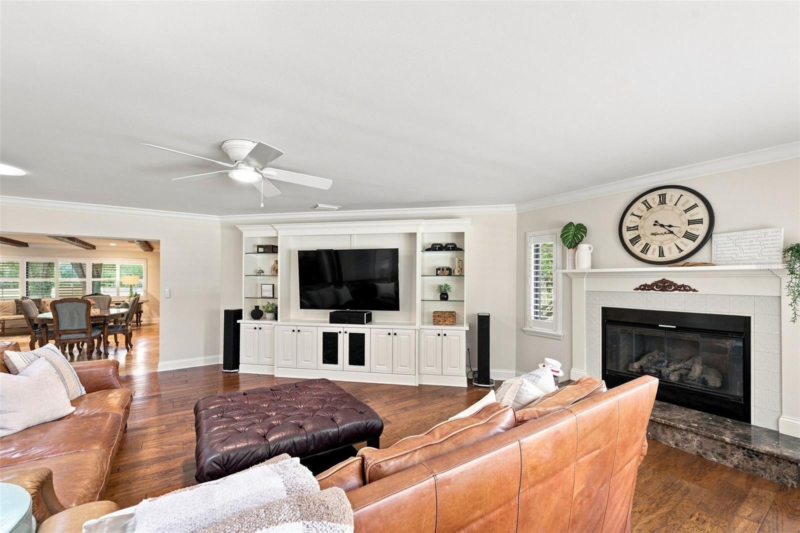 The family room opens off the Kitchen and features expansive views of the backyard and a cozy fireplace.