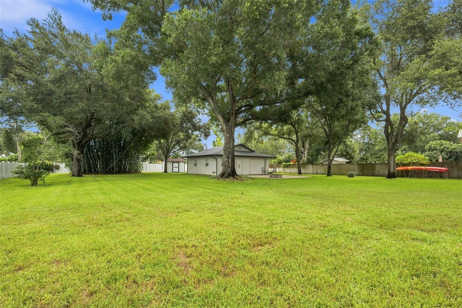 Tucked privately within the backyard, the air-conditioned detached structure with electricity is truly a standout feature of the property.