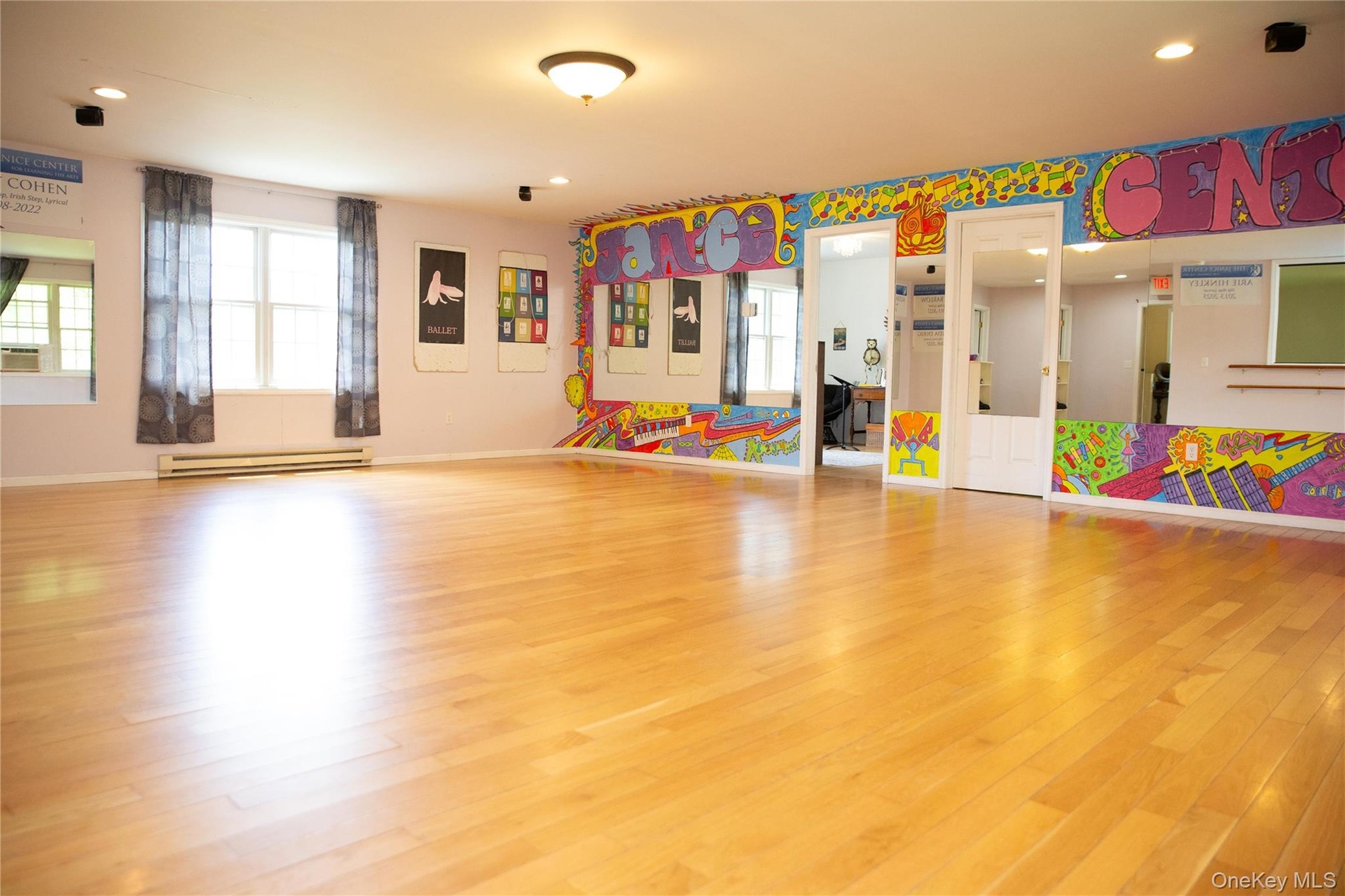 Second commercial space has wide open rooms and rooms perfect for offices