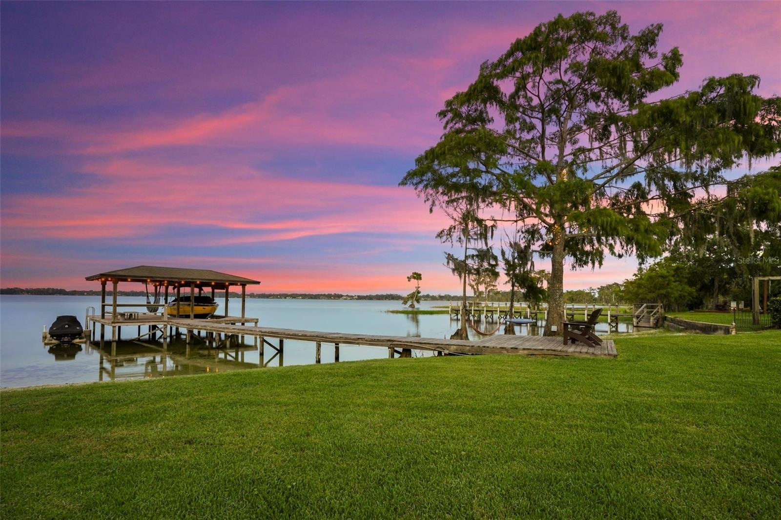 A private dock and boatlift provide immediate access to Lake Sheen and the entire Butler Chain, while a gated community boat ramp is approximately 300