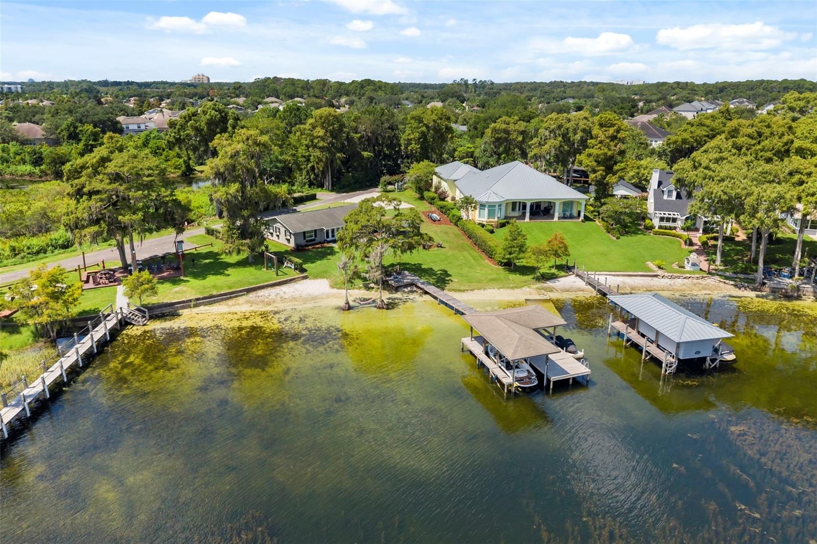 An exceptional opportunity to own one of the most compelling lakefront properties on Lake Cottage Lane, featuring an oversized homesite, expansive Lak