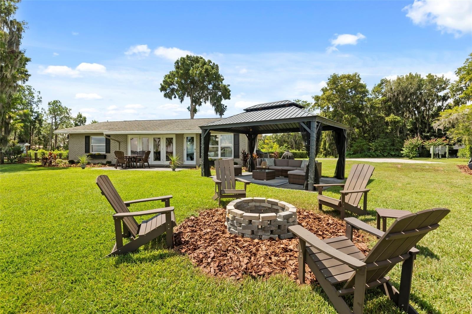 Lake Cottage Lane, featuring an oversized homesite, expansive Lake Sheen views, sandy shoreline, private dock and boatlift, and an existing 2BR/1.5BA 