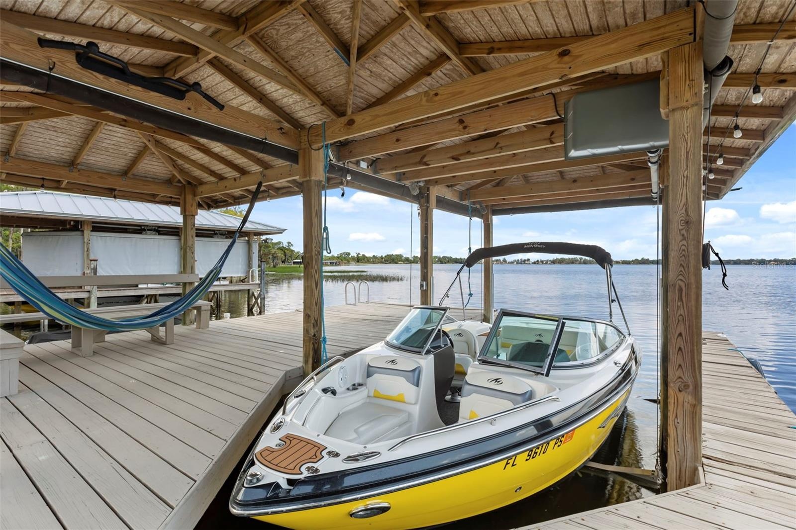 A private dock and boatlift provide immediate access to Lake Sheen and the entire Butler Chain, while a gated community boat ramp is approximately 300
