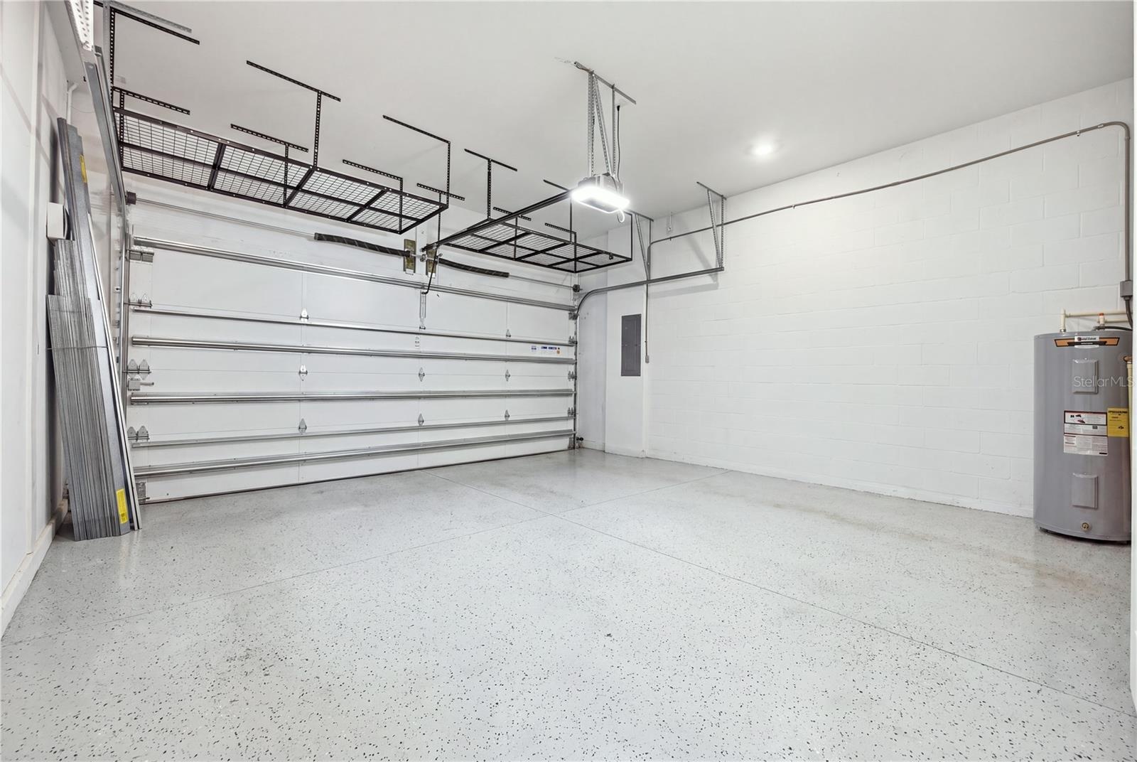 Oversized garage with high ceilings and overhead storage