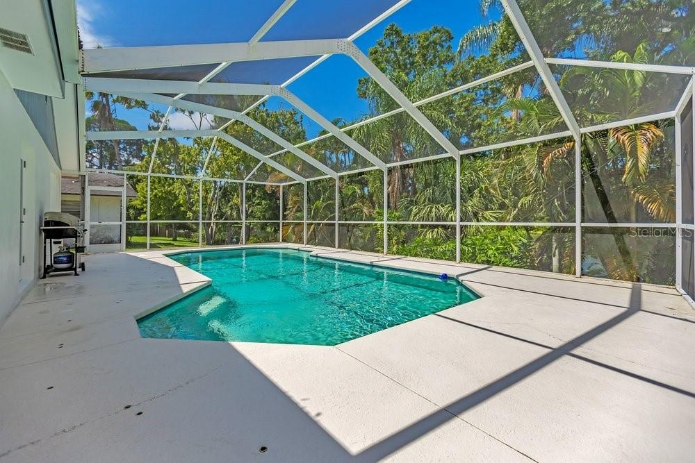 Screened pool area is a private retreat with lake and preserve as your rear neighbor