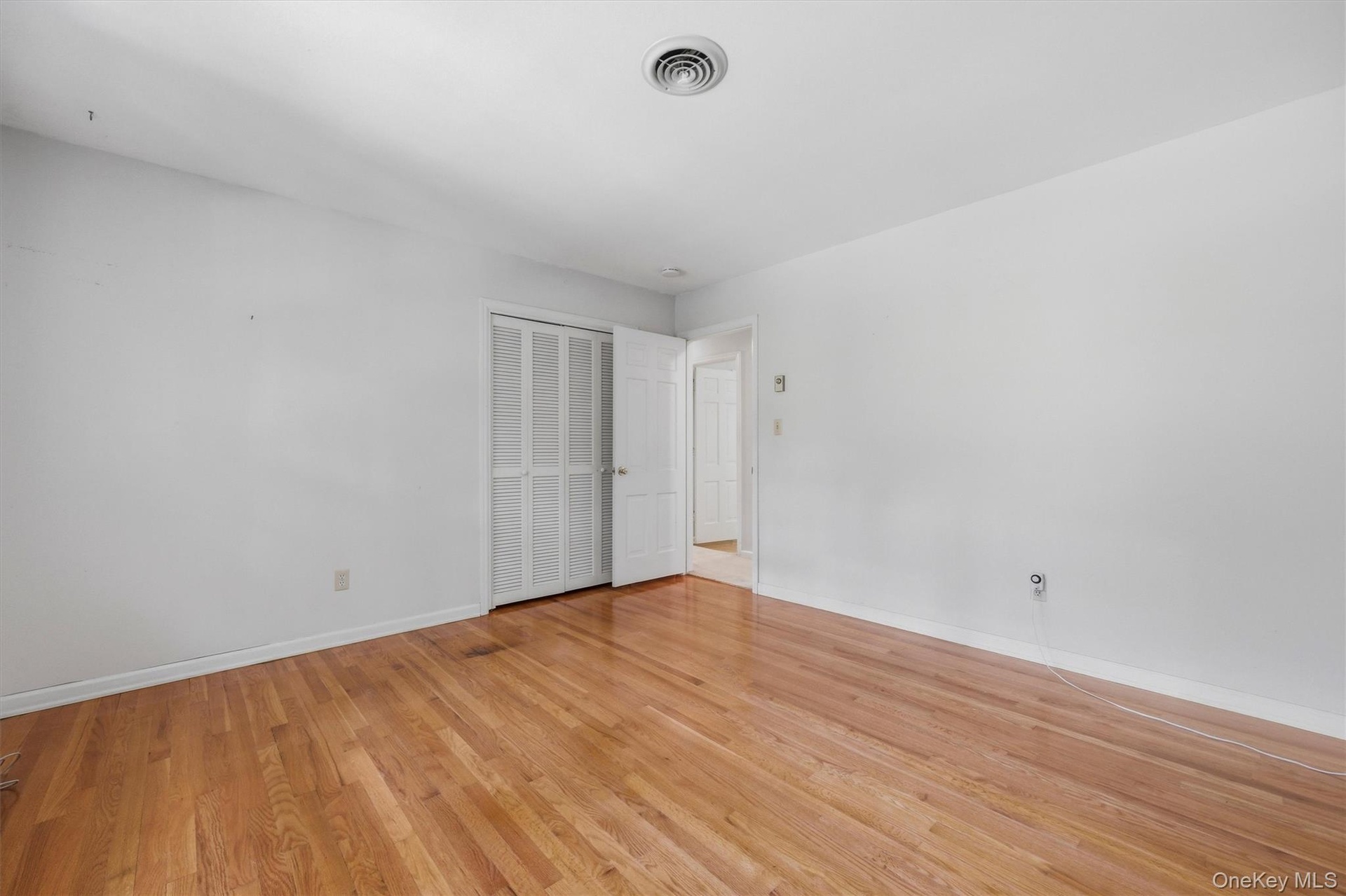Bedroom 2 with hardwood floors