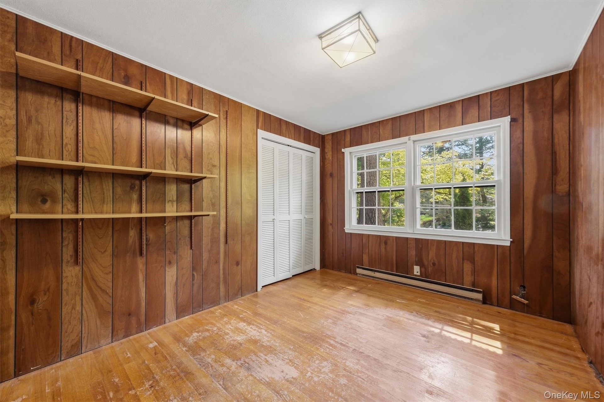 Office/den with hardwood floors