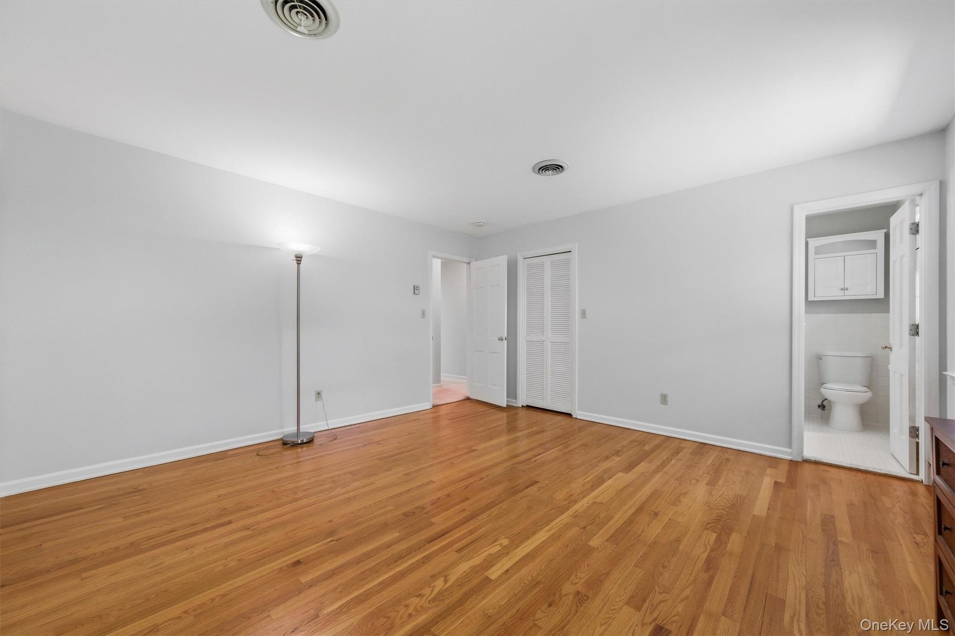 Primary en suite with large walk-in closet and private bath