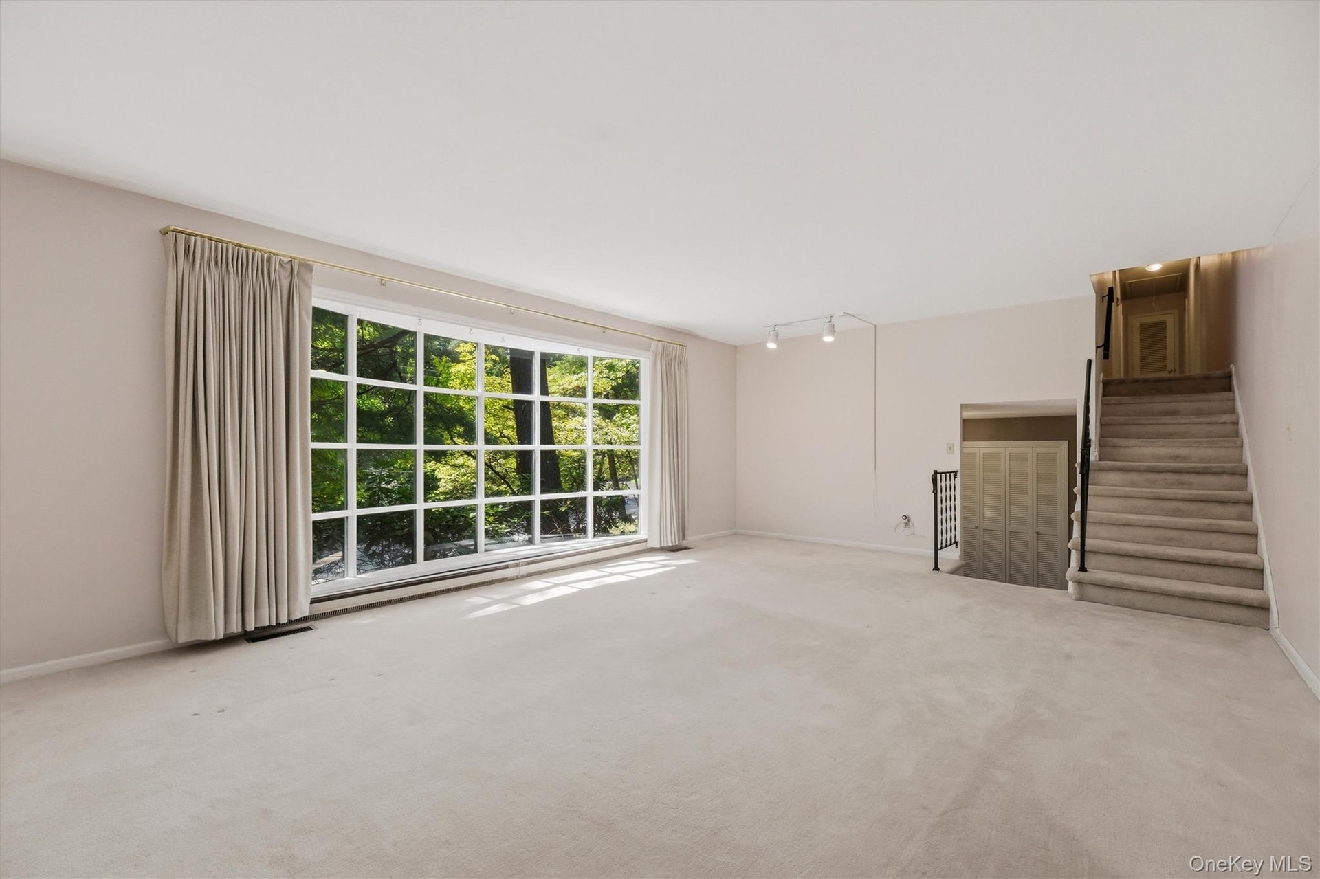 Living room stairs to upper floor and bedrooms